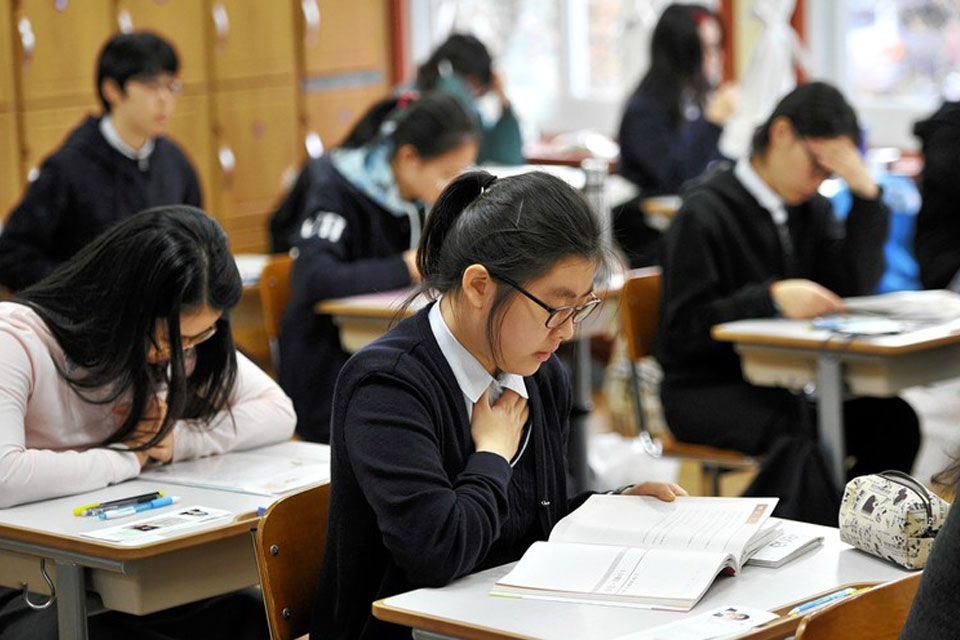 Engaging students in a South Korean classroom, a rewarding part of the E-2 visa experience.